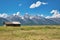 Antelope Flats road scenario, Grand Teton. Mountains and wooden homes