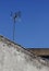 Antena on a roof of an old desolate house