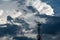 Antenna tower and repeater of Communication with White fluffy clouds in the blue sky background