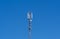 Antenna tower of telecommunication and signal repeater of mobile communication with blue sky