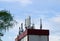 Antennas for cellular communications and Internet connections on the roof of buildings against a blue sky