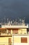 Antennas on a roof, against a cloudy sky