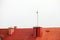 Antenne on red roof white sky