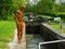 Anthony Gormley sculpture besides a canal lock