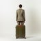 Anthony With Green Luggage: A Stylish And Polished Travel Companion