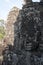 Anthropomorphic faces carved into stone at the Bayon Wat, a 12th century temple within the Angkor Thom complex