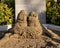 Anthropomorphic sand sculpture in a sandbox at a resort on the Island of Maui in the state of Hawaii.
