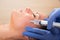 Anti aging facial mesotherapy syringe on woman face