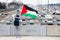 Anti-Israel Protestors Waves Palestinian Flag to Drivers on Highway 401 in Toronto