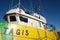 Anti-pollution vessel TAGIS of Castalia anchored at the port of La Spezia. Painted hull of various colors: Yellow, green, red