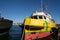 Anti-pollution vessel TAGIS of Castalia anchored at the port of La Spezia. Painted hull of various colors: Yellow, green, red