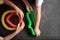 Anti stress sensory pop tube toys in a children`s hands. a little happy kids plays with a poptube toy on a black table. toddlers