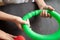Anti stress sensory pop tube toys in a children`s hands. a little happy kids plays with a poptube toy on a black table. toddlers