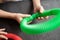 anti stress sensory pop tube toys in a children`s hands. a little happy kids plays with a poptube toy on a black table. toddlers