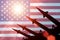 Antiaircraft rockets silhouettes on background of USA flag