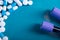 Antibiotic and probiotics pills on a blue background. Pharmaceutical concept with empty space for text