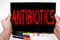 Antibiotics text written on tablet, computer in the office with marker, pen, stationery. Business concept for Health