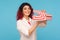 In anticipation of surprise. Portrait of attractive hipster woman with fancy red hair holding opened gift box