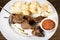 Anticuchos, Peruvian cuisine, grilled skewered beef heart meat with boiled potato and white corn