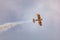 Antidotum Airshow Leszno 2023 and acrobatic shows of yellow Boeing Stearman plane on a blue clouy
