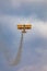 Antidotum Airshow Leszno 2023 and acrobatic shows of yellow Boeing Stearman plane on a blue clouy