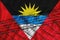 Antigua and barbuda flag development, fence mesh and barbed wire. Emigrants isolation concept. With place for your text