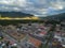 Antigua Cityscape in Guatemala. Volcano in Background. Bus Station