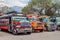 ANTIGUA, GUATEMALA - MARCH 28, 2016: Colourful chicken buses, former US school buses, are lined up at the main bus