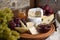 Antipasti. Cheese camembert with fruit and wine