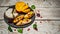 Antipasti snacks. Brushetta with mango, Camembert cheese and pomegranate served on a shale board, rustic wooden table. copy space