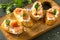 Antipasti snacks for Wine. Brushetta with Soft Cheese and Salmon