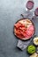 Antipasto. Meat platter, chips and sauces, red wine on gray background. Top view