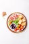 Antipasto Plate with dried bread, ham serrano, tomato cherry and purple olives. White background.