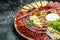 Antipasto platter jamon, prosciutto, ham, beef jerky, salami and cheese platter. Appetizer, catering food concept. place for text