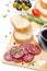 Antipasto - salami, bread, olives and glass of wine