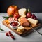 Antipasto on wooden board with cheese, meats and fruit