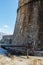 Antique anchor at walls of the Old town of Mediterranean city Budva