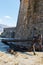 Antique anchor at walls of the Old town of Mediterranean city Budva