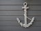 Antique anchor on wooden grey background
