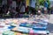 Antique antiques are sold at a flea market.Books, laid out on the sidewalk. Selective focus.