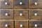 Antique apothecary wood closet with drawers