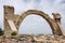 Antique arch against the blue sky. The ruins of Ephesus. Close-up. Space for text