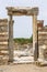 Antique arch against the blue sky. The ruins of Ephesus. Close-up. Space for text.