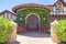 Antique arched double door with wrought iron in a mediterranean style house in La Jolla, California