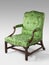 Antique arm chair light green upholstery on light background