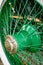 Antique automotive wheel with green spokes