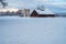 Antique barn and silos on snowy morning Sierra Nevada mountains California