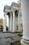 antique beautiful ancient old stone building with large white high concrete columns