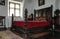 Antique bed. Interior rooms of the medieval Bran Castle in Romania