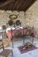 Antique bedroom in italy with wrought iron bed and bed warmer (or warming pan).